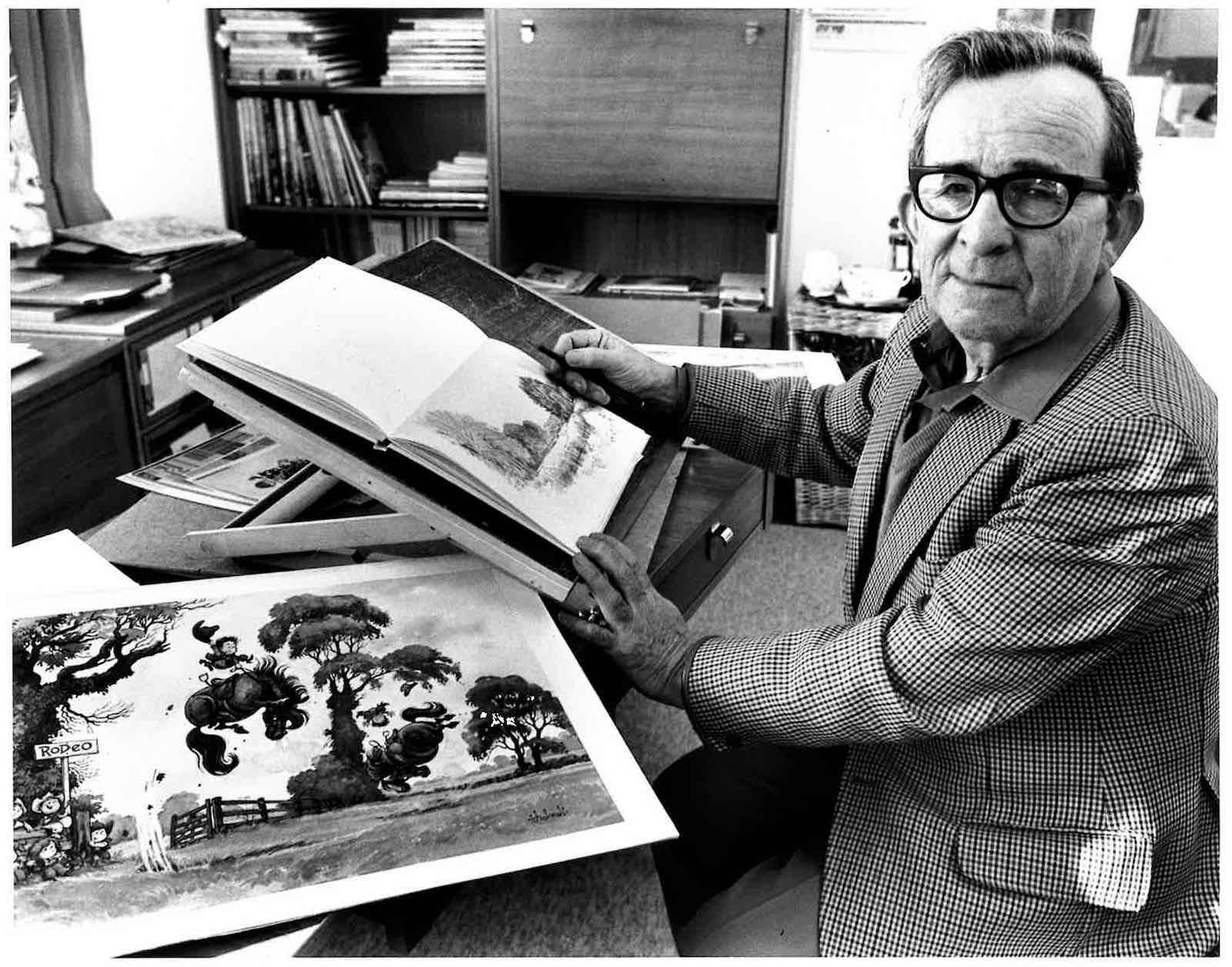 Norman Thelwell at his drawing board