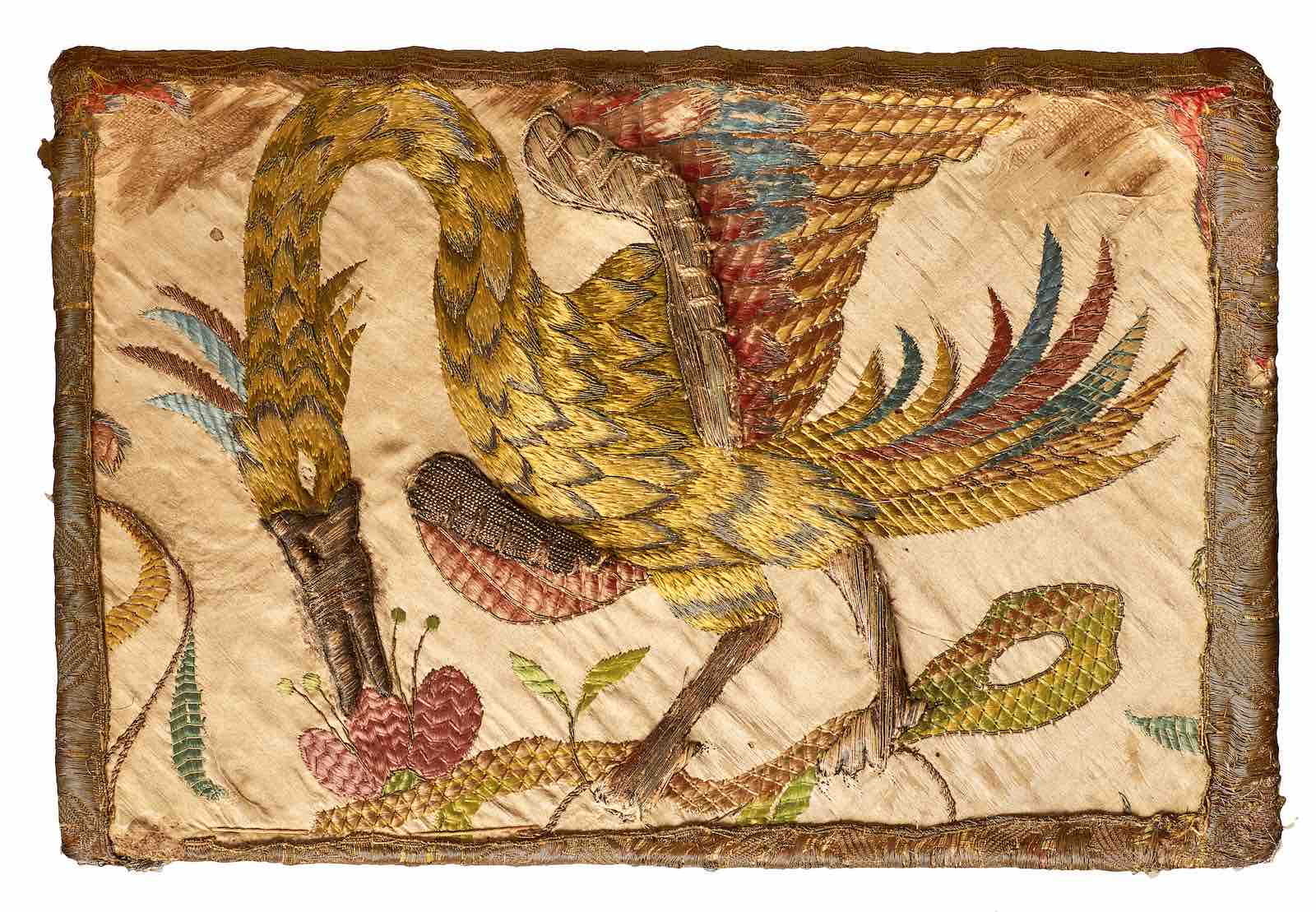 Confucius’ Confucius sinarum philosophus, in a binding covered with embroidered ivory silk, 1687.