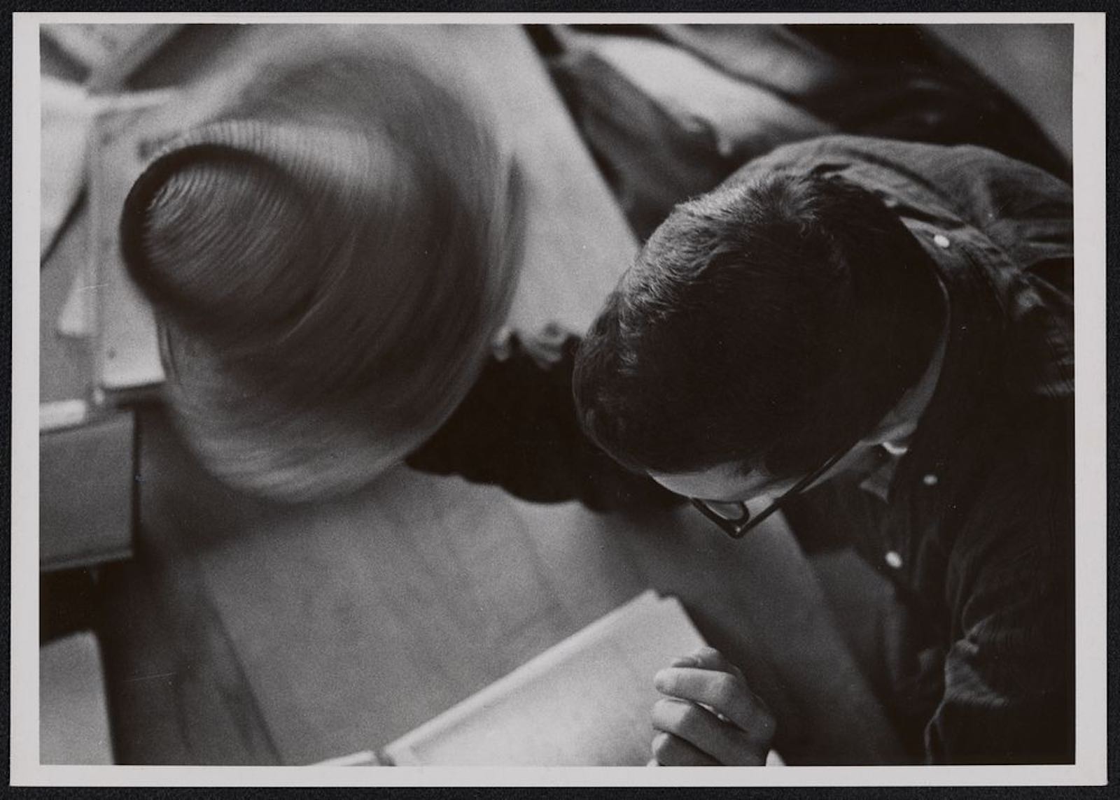 Twirling hat in library