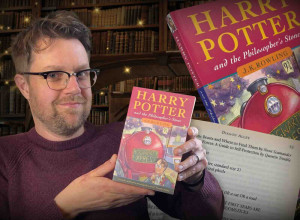 Jim Spencer with the paperback copy of Harry Potter and the Philosopher’s Stone