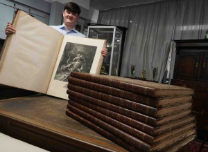 Auctioneer Jack Orgill with the books