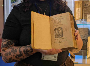 Clare Marshall of Marshall Rare Books with the expanded edition of Johann Weyer's Praestigiis Daemonum, Et Incantationibus ac ueneficiis